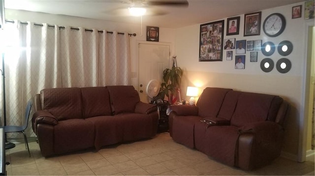 living room with ceiling fan and light tile patterned floors