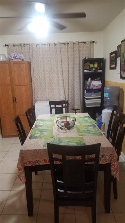 dining area with ceiling fan and light tile patterned floors