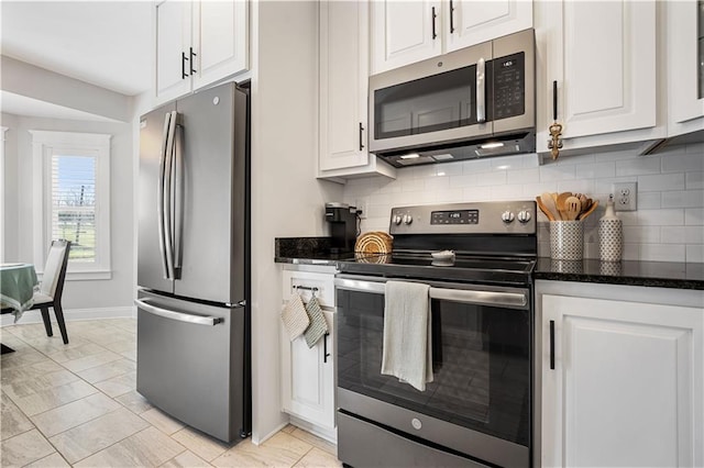 kitchen featuring white cabinets, tasteful backsplash, and stainless steel appliances