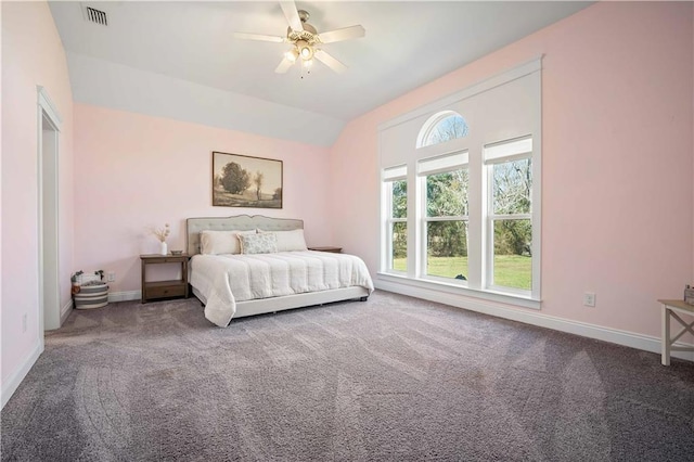 unfurnished bedroom with lofted ceiling, baseboards, visible vents, and carpet flooring