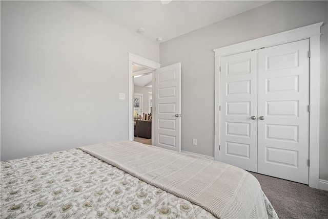 bedroom featuring carpet and a closet