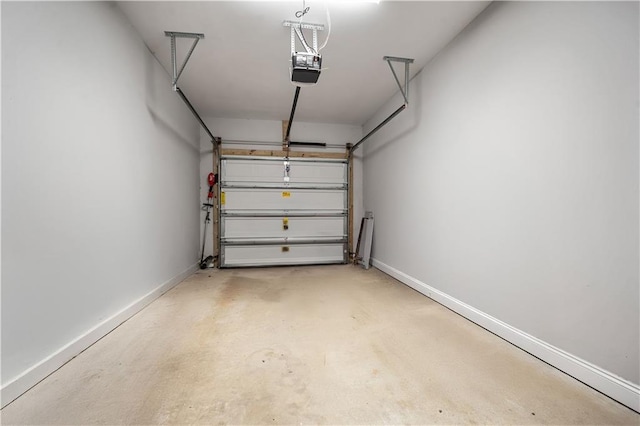 garage featuring baseboards and a garage door opener