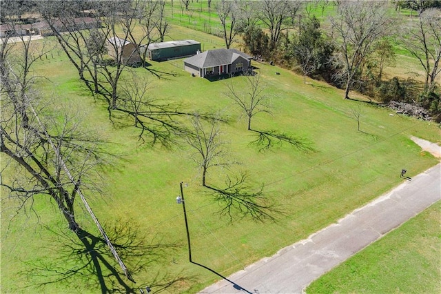 birds eye view of property with a rural view