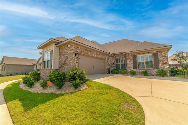 view of front of home featuring a front yard and a garage