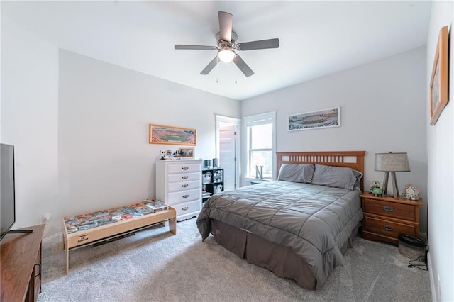 bedroom featuring ceiling fan and light carpet