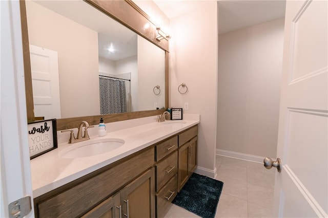 bathroom with tile patterned floors and vanity