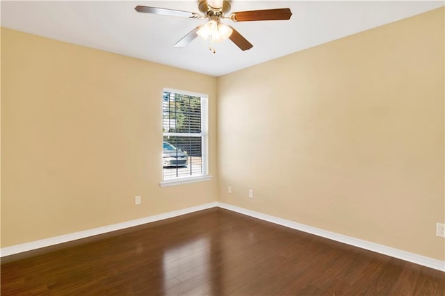 unfurnished room with ceiling fan and dark hardwood / wood-style floors