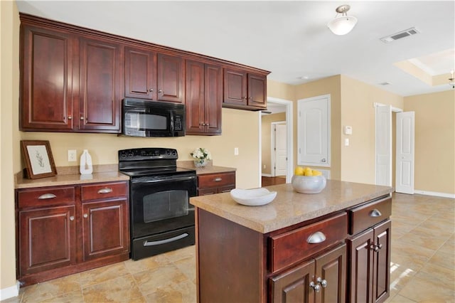 kitchen featuring a center island and black appliances