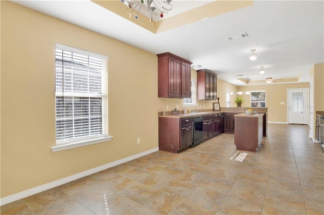 kitchen with sink, kitchen peninsula, dishwasher, a raised ceiling, and ceiling fan