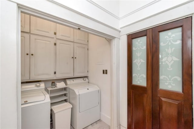 laundry area with cabinet space and washing machine and dryer