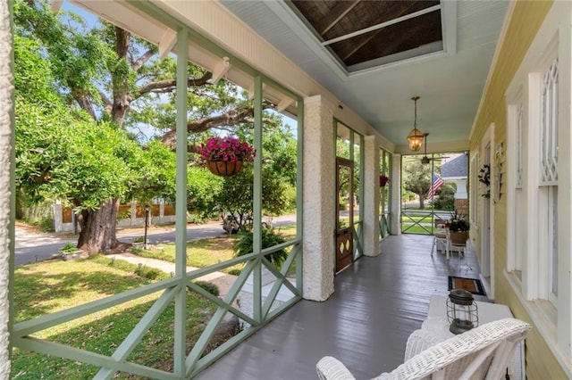 sunroom / solarium featuring wood finished floors