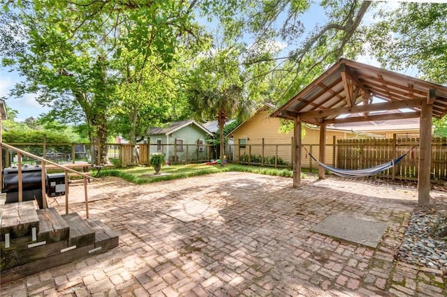 view of patio / terrace with a gazebo and a fenced backyard