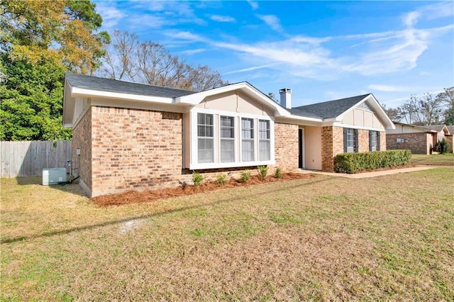 view of property exterior with a yard