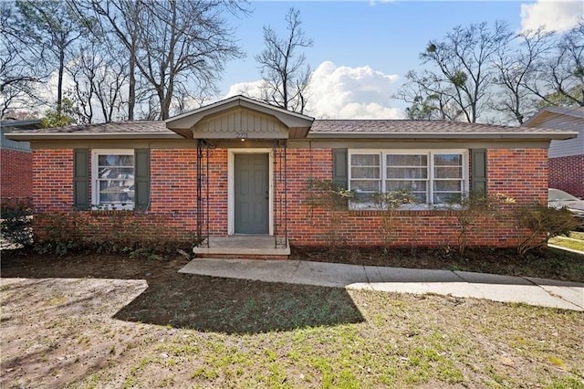 single story home with brick siding