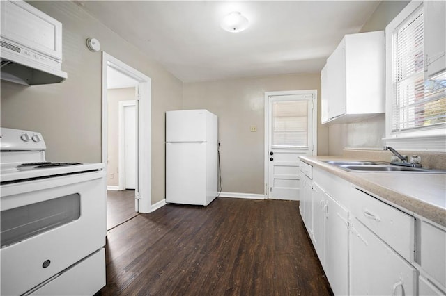 kitchen with a sink, white appliances, white cabinetry, and custom range hood