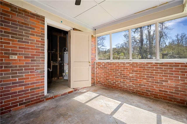 unfurnished sunroom featuring gas water heater