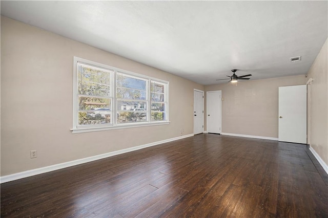 unfurnished living room with visible vents, baseboards, wood finished floors, and a ceiling fan