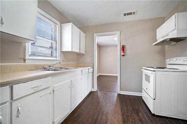 kitchen featuring white electric stove, visible vents, light countertops, and a sink