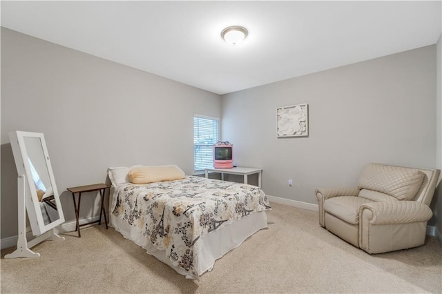 bedroom with light carpet