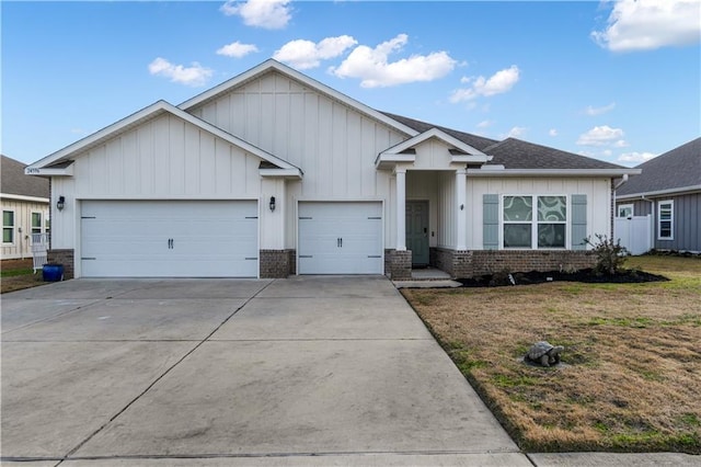 view of front of house with a garage and a front yard