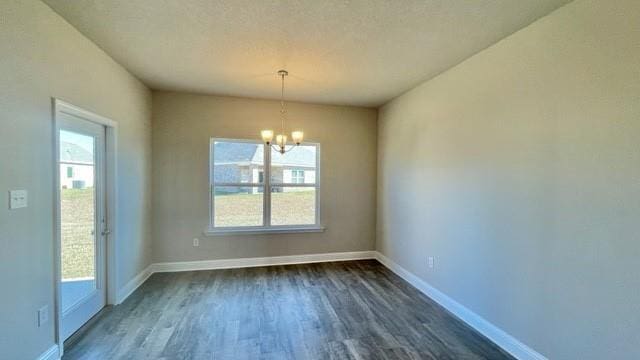 10706 Relic Rd N, Mobile, AL 36608 - unfurnished dining area with a chandelier, healthy amount of natural light, and dark wood-style floors