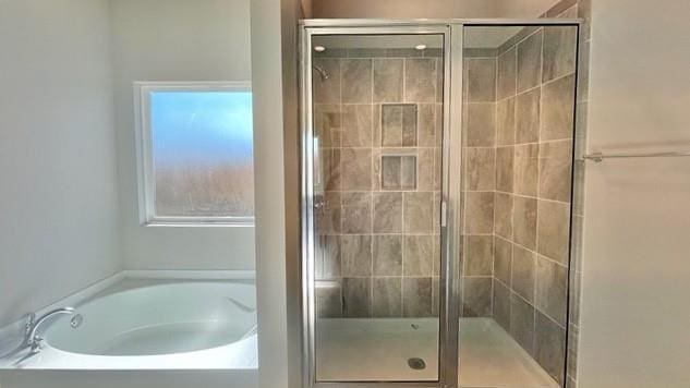 10706 Relic Rd N, Mobile, AL 36608 - bathroom featuring a bath and a shower stall