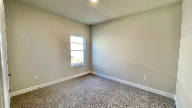 10706 Relic Rd N, Mobile, AL 36608 - carpeted empty room featuring baseboards