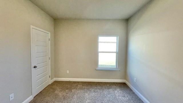 10706 Relic Rd N, Mobile, AL 36608 - unfurnished room featuring dark colored carpet and baseboards