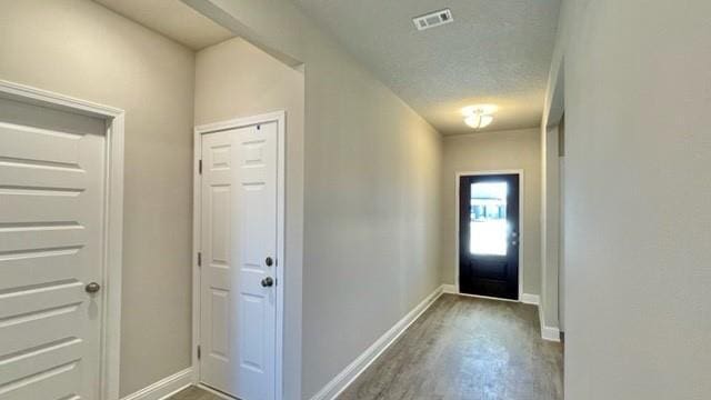 10706 Relic Rd N, Mobile, AL 36608 - entryway with baseboards and wood finished floors