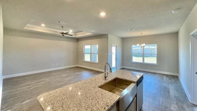 10706 Relic Rd N, Mobile, AL 36608 - kitchen featuring wood finished floors, open floor plan, a raised ceiling, ceiling fan, and recessed lighting