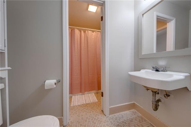 bathroom with tile patterned floors