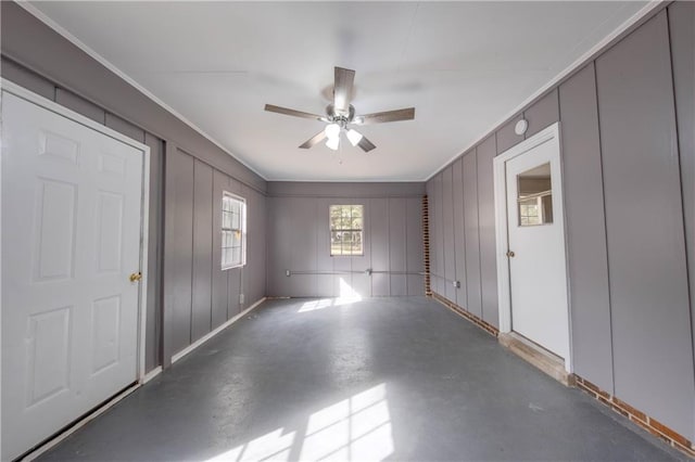 unfurnished room featuring ornamental molding and ceiling fan