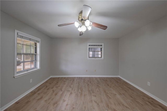 unfurnished room with ceiling fan and light hardwood / wood-style flooring