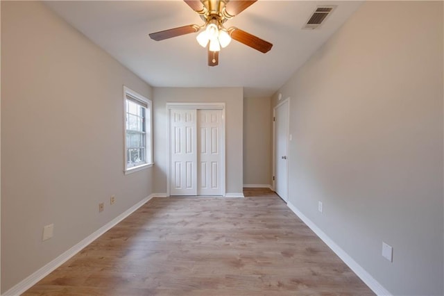 unfurnished bedroom with a closet, ceiling fan, and light hardwood / wood-style floors