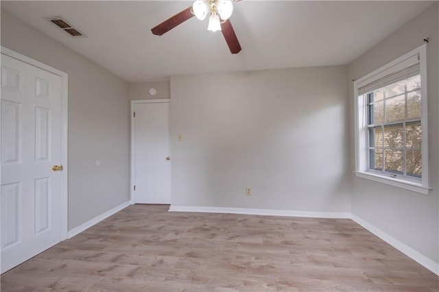 spare room with ceiling fan and light hardwood / wood-style floors