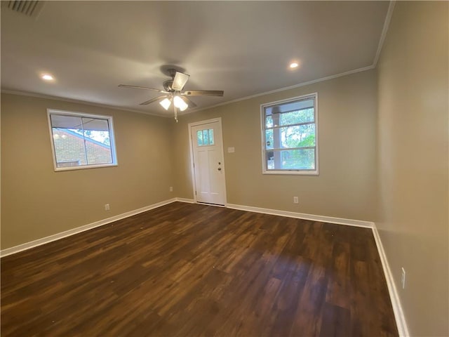 entryway with ceiling fan, dark hardwood / wood-style flooring, and ornamental molding