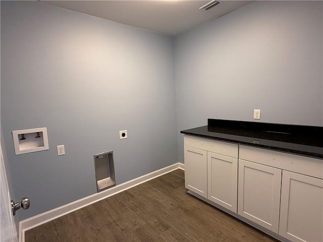 clothes washing area featuring hookup for an electric dryer, hookup for a washing machine, cabinets, and dark wood-type flooring