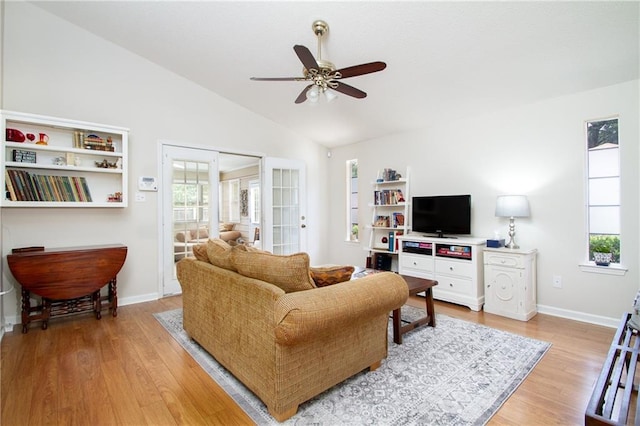 1000 Pinemont Dr, Mobile, AL 36609 - living area with a ceiling fan, vaulted ceiling, and light wood-style flooring