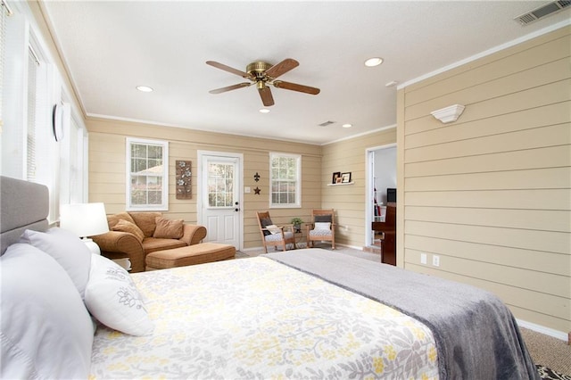 1000 Pinemont Dr, Mobile, AL 36609 - bedroom with crown molding, wooden walls, recessed lighting, carpet flooring, and ceiling fan