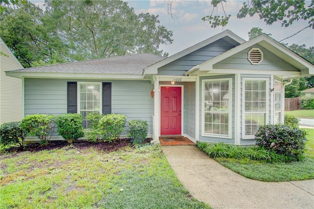 1000 Pinemont Dr, Mobile, AL 36609 - view of front of property with a front yard and a shingled roof