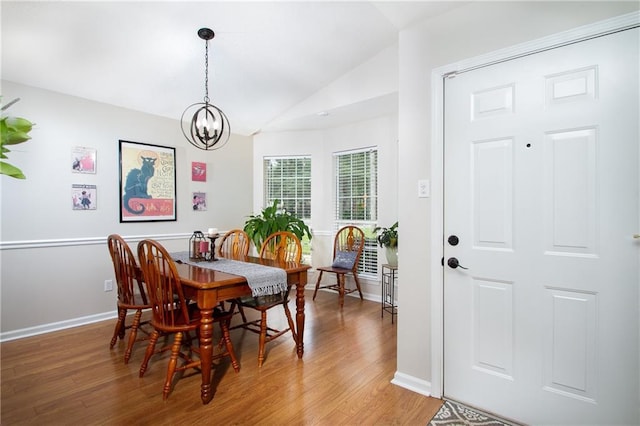 1000 Pinemont Dr, Mobile, AL 36609 - dining area with vaulted ceiling, light wood-style floors, and a chandelier