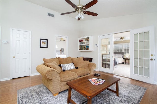 1000 Pinemont Dr, Mobile, AL 36609 - living room featuring ceiling fan, lofted ceiling, wood finished floors, and french doors