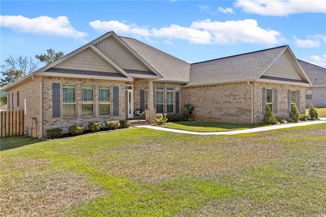 craftsman inspired home with a front lawn