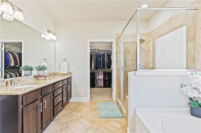 bathroom with vanity, tile patterned flooring, and plus walk in shower