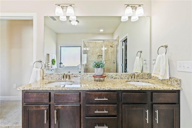 bathroom with vanity and walk in shower