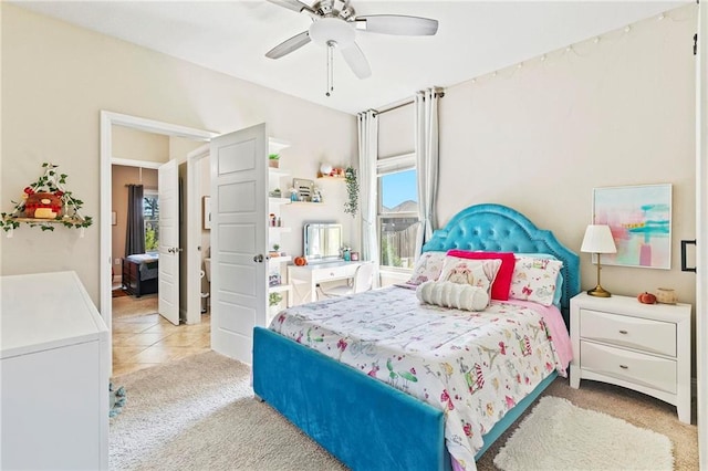 tiled bedroom featuring ceiling fan