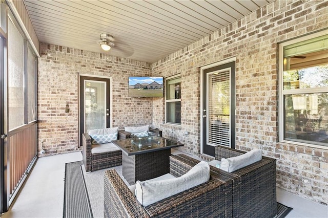 view of patio with outdoor lounge area and ceiling fan