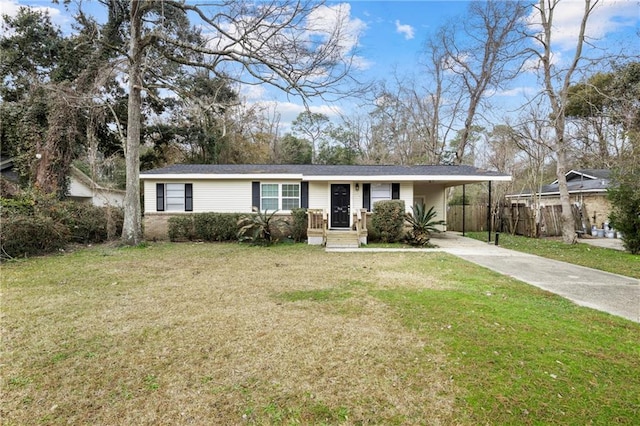 ranch-style home featuring a front lawn and a carport