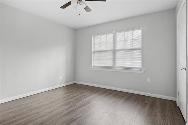 empty room featuring hardwood / wood-style flooring and ceiling fan