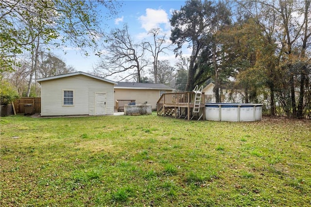 view of yard with a pool side deck